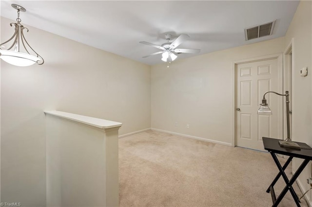 825 Central Park Ave, Greensboro, NC 27407 - spare room featuring light colored carpet, ceiling fan, and baseboards