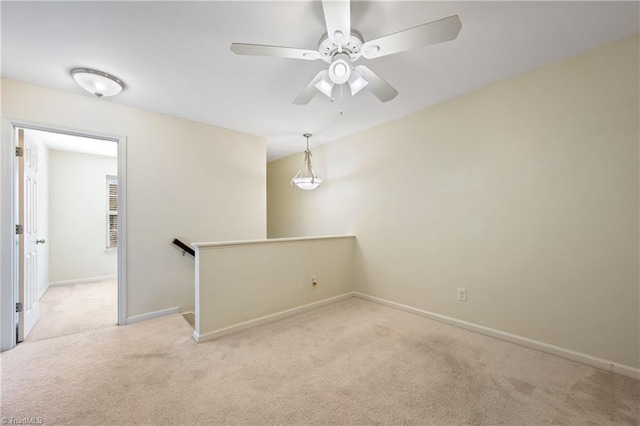 825 Central Park Ave, Greensboro, NC 27407 - unfurnished room with carpet, baseboards, and ceiling fan
