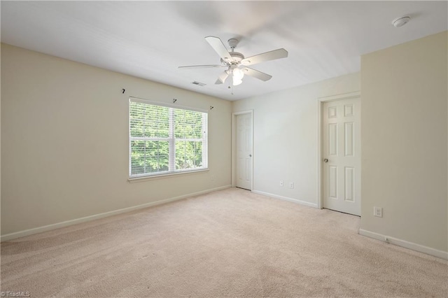 825 Central Park Ave, Greensboro, NC 27407 - unfurnished room with a ceiling fan, light colored carpet, and baseboards