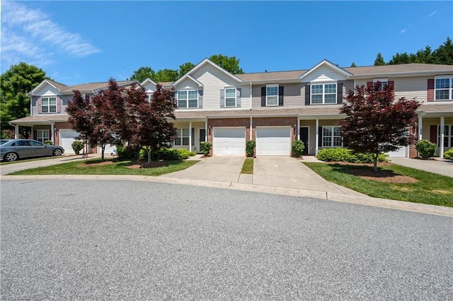 825 Central Park Ave, Greensboro, NC 27407 - townhome / multi-family property with driveway and an attached garage