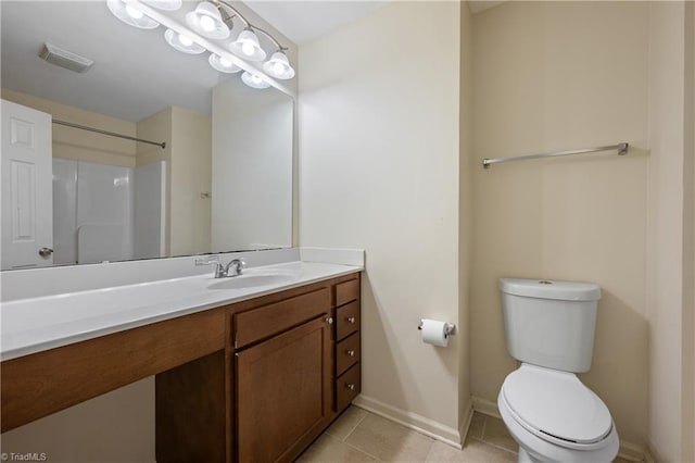825 Central Park Ave, Greensboro, NC 27407 - full bathroom with tile patterned flooring, toilet, vanity, baseboards, and a shower