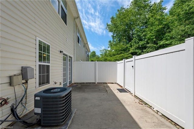 825 Central Park Ave, Greensboro, NC 27407 - view of side of property featuring cooling unit, a patio area, and a fenced backyard