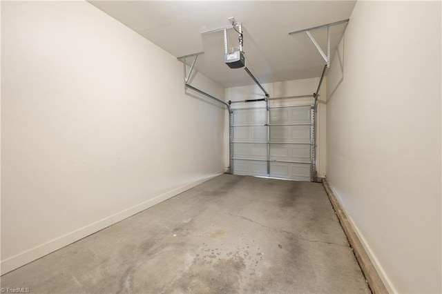 825 Central Park Ave, Greensboro, NC 27407 - garage featuring a garage door opener and baseboards