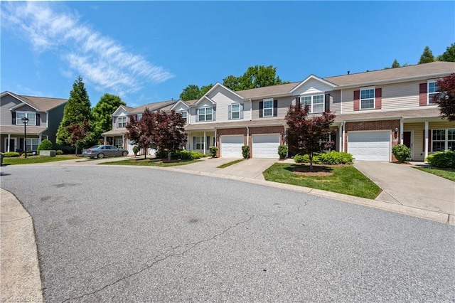 825 Central Park Ave, Greensboro, NC 27407 - townhome / multi-family property featuring driveway, a residential view, and a garage