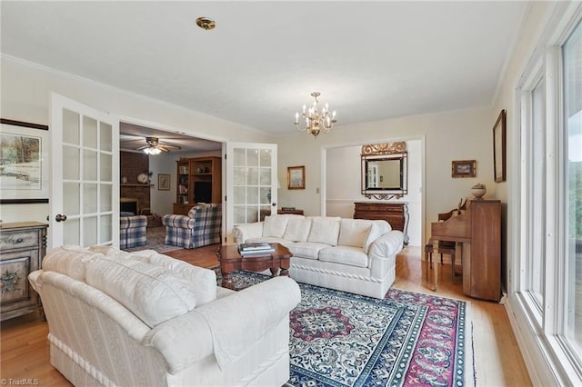 174 Sunny Knoll Ln, Boone, NC 28607 - living area with light wood-style floors, a chandelier, ceiling fan, and french doors