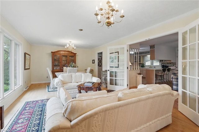 174 Sunny Knoll Ln, Boone, NC 28607 - living room with a chandelier, healthy amount of natural light, and light wood-style floors