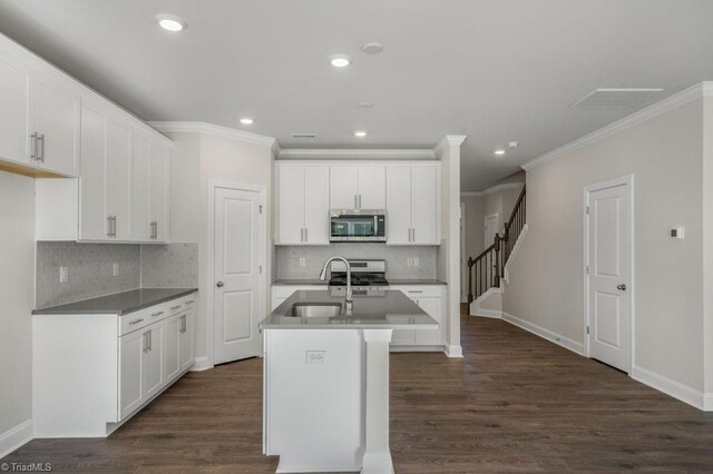 1404 Amberview Ln, Kernersville, NC 27284 - kitchen with stainless steel microwave, tasteful backsplash, ornamental molding, and a sink