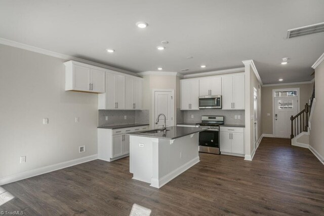 1404 Amberview Ln, Kernersville, NC 27284 - kitchen with ornamental molding, stainless steel appliances, visible vents, and a sink
