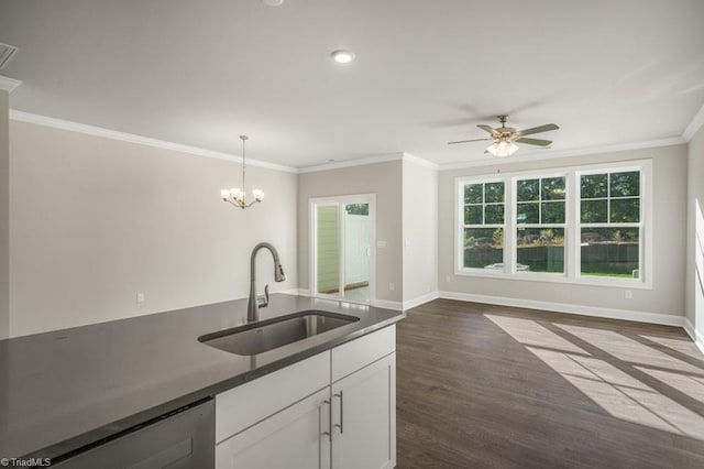 1404 Amberview Ln, Kernersville, NC 27284 - kitchen with a sink, dark wood-style flooring, baseboards, dishwasher, and ornamental molding