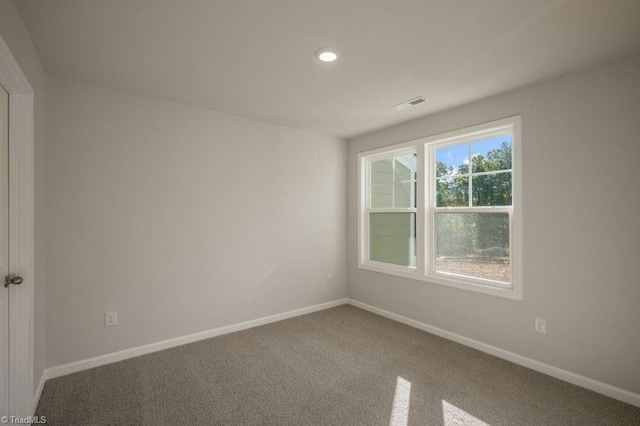 1404 Amberview Ln, Kernersville, NC 27284 - spare room featuring recessed lighting, carpet floors, visible vents, and baseboards