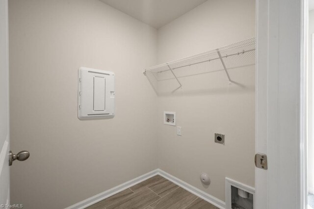 1404 Amberview Ln, Kernersville, NC 27284 - laundry room featuring laundry area, dark wood-type flooring, electric panel, hookup for a washing machine, and electric dryer hookup