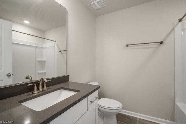 1404 Amberview Ln, Kernersville, NC 27284 - bathroom featuring toilet, baseboards, visible vents, wood finished floors, and vanity