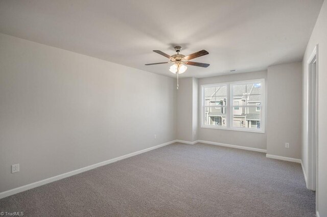 1404 Amberview Ln, Kernersville, NC 27284 - unfurnished room featuring visible vents, baseboards, carpet flooring, and ceiling fan