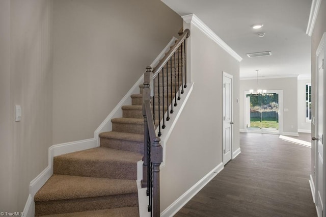 1404 Amberview Ln, Kernersville, NC 27284 - stairway with crown molding, wood finished floors, a chandelier, baseboards, and visible vents