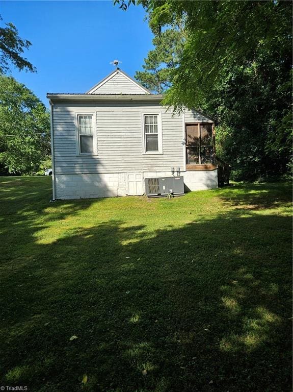 215 9th St, Spencer, NC 28159 - back of property featuring a yard