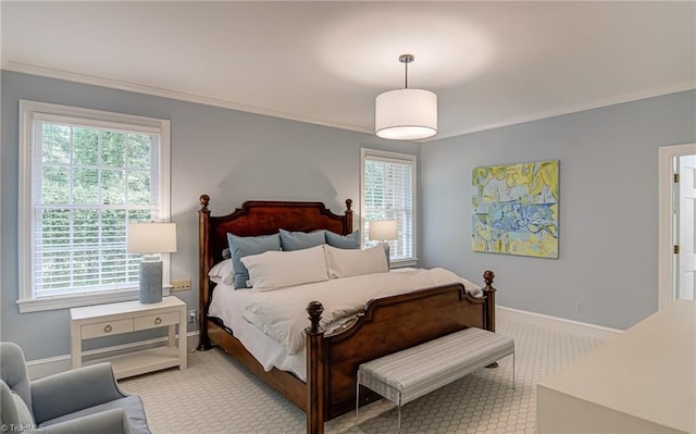 bedroom featuring baseboards, multiple windows, ornamental molding, and carpet flooring