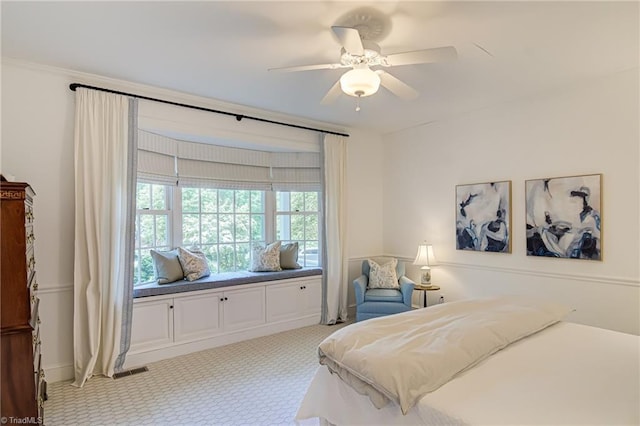 bedroom featuring visible vents, a ceiling fan, and carpet floors