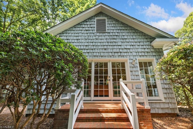 back of property featuring french doors