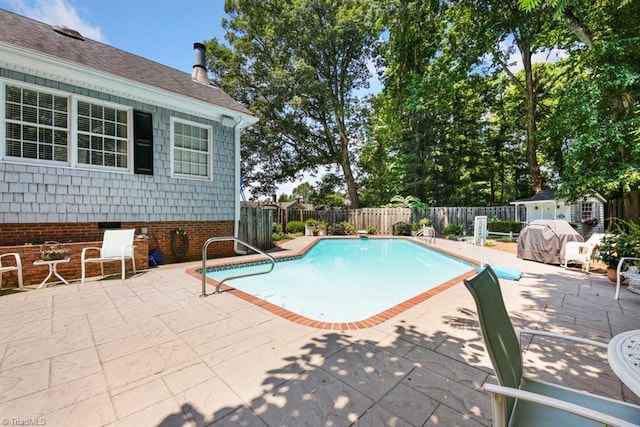view of pool featuring a patio, a fenced backyard, and a fenced in pool