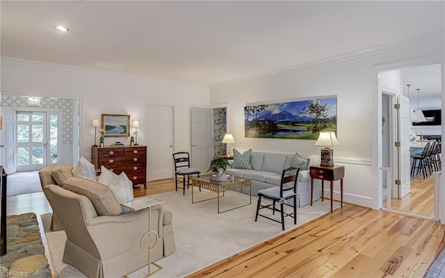 living room featuring crown molding and wood finished floors