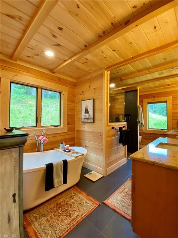 1295 Will Vannoy Rd, West Jefferson, NC 28694 - full bathroom with a wood ceiling with exposed beams, vanity, a freestanding bath, wood walls, and tile patterned flooring
