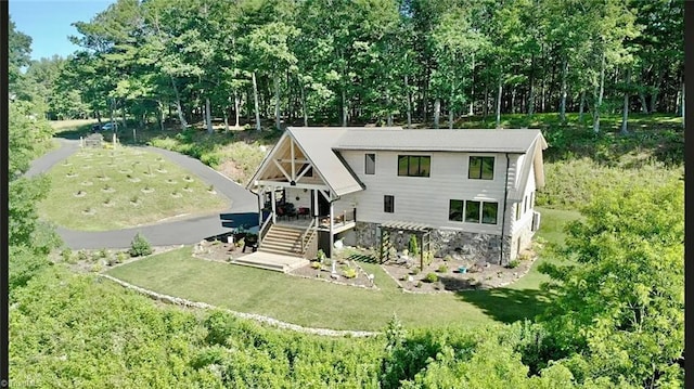 1295 Will Vannoy Rd, West Jefferson, NC 28694 - view of front of property featuring stone siding, a front yard, and covered porch