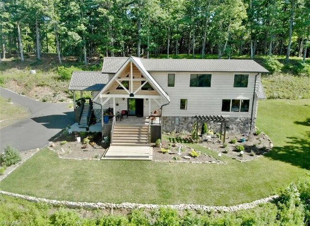 1295 Will Vannoy Rd, West Jefferson, NC 28694 - view of front facade with stone siding, a front yard, covered porch, a pergola, and stairs