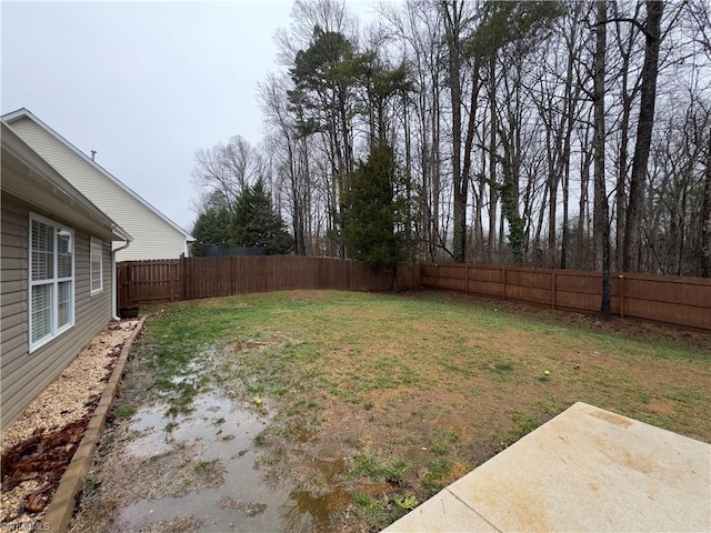 view of yard with a fenced backyard