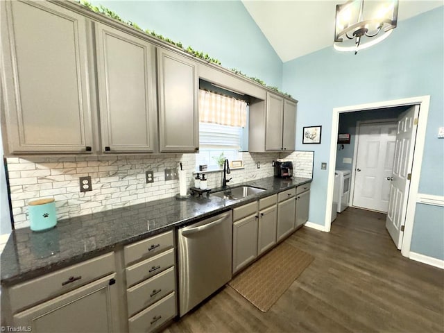 kitchen featuring a sink, vaulted ceiling, dishwasher, and gray cabinetry