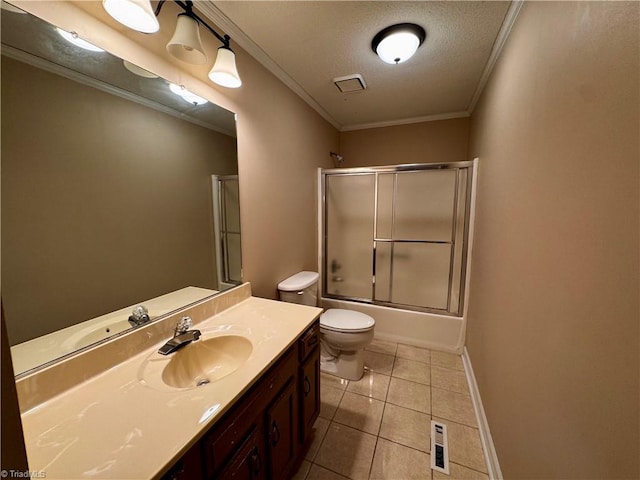 full bathroom featuring toilet, crown molding, tile patterned floors, bath / shower combo with glass door, and vanity