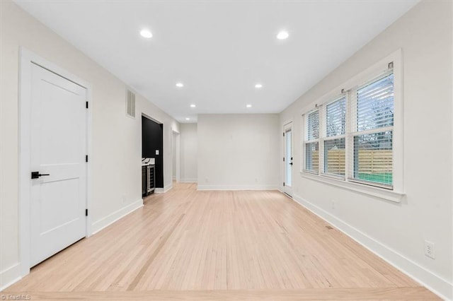 unfurnished room featuring light hardwood / wood-style floors