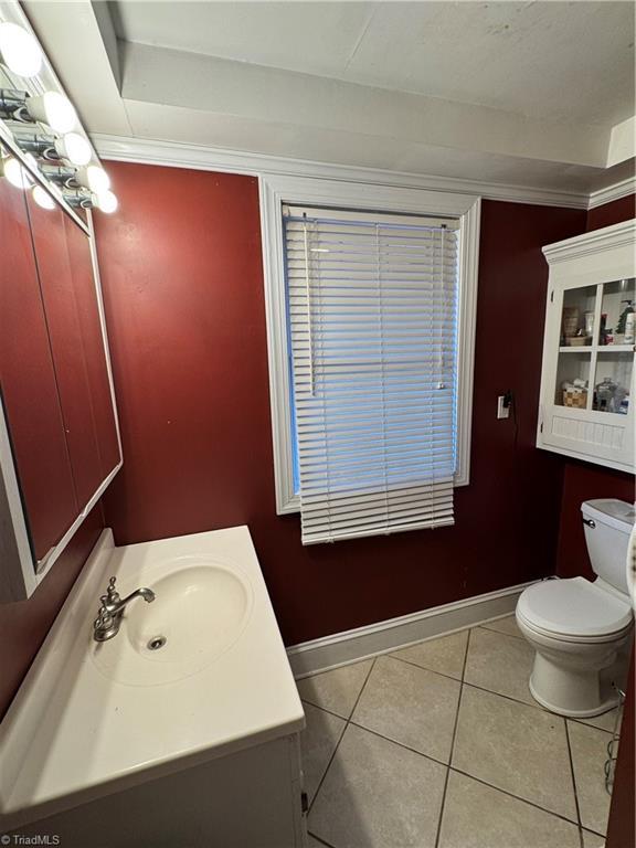 209 Abernathy St NW, Lenoir, NC 28645 - half bathroom with vanity, toilet, baseboards, and tile patterned flooring