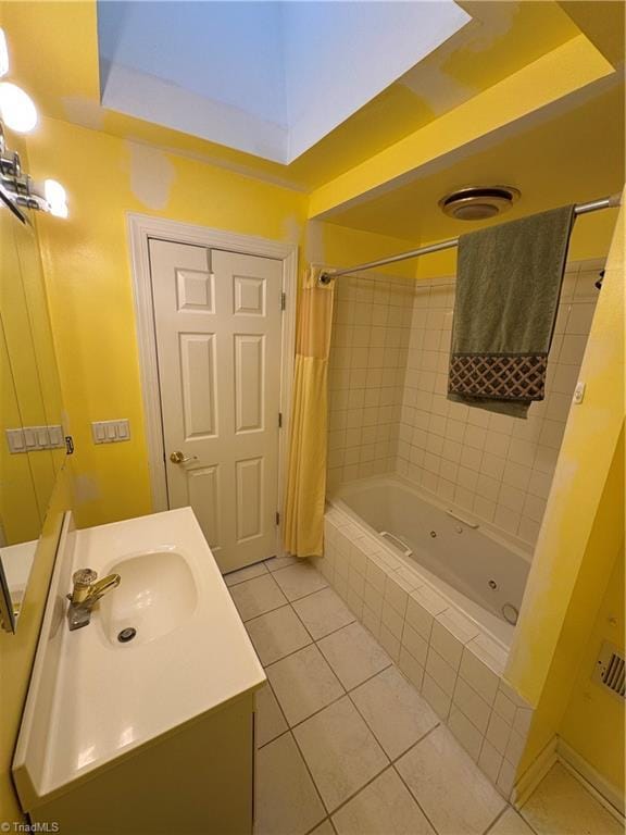 209 Abernathy St NW, Lenoir, NC 28645 - full bathroom featuring tile patterned floors, a combined bath / shower with jetted tub, and vanity