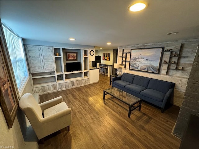 209 Abernathy St NW, Lenoir, NC 28645 - living room with wood finished floors, recessed lighting, built in features, and wood walls