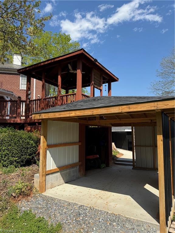 209 Abernathy St NW, Lenoir, NC 28645 - view of front of property with a carport and a wooden deck
