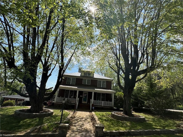209 Abernathy St NW, Lenoir, NC 28645 - rear view of property featuring a porch, metal roof, and a yard