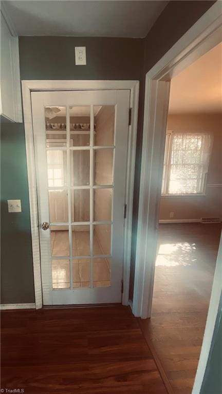 hallway featuring dark wood-type flooring