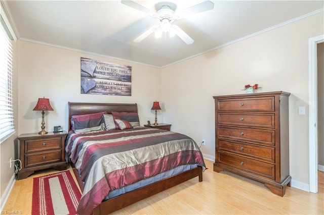 bedroom with ceiling fan, ornamental molding, and light hardwood / wood-style floors