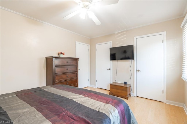 bedroom featuring crown molding, ceiling fan, and light wood-type flooring