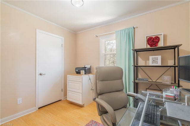 office with ornamental molding and light hardwood / wood-style floors