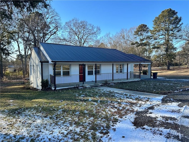 ranch-style house with a yard and covered porch