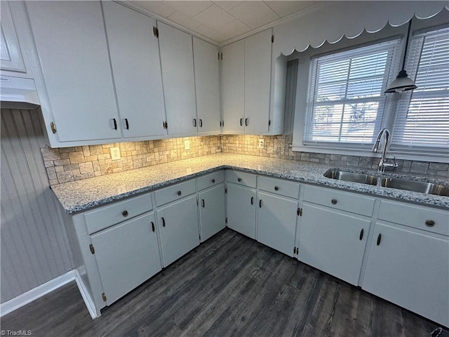 kitchen featuring sink and white cabinets