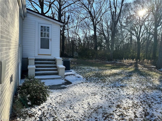 yard covered in snow with cooling unit