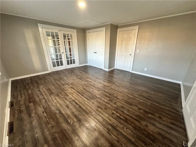 spare room with ornamental molding, dark hardwood / wood-style floors, and french doors