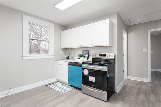 kitchen featuring light wood finished floors, dishwashing machine, stainless steel range with electric stovetop, and white cabinetry