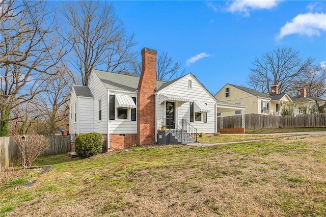 view of front of house with crawl space, a chimney, a front yard, and fence