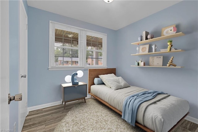 2102 Bothwell St, Greensboro, NC 27401 - bedroom featuring wood finished floors and baseboards