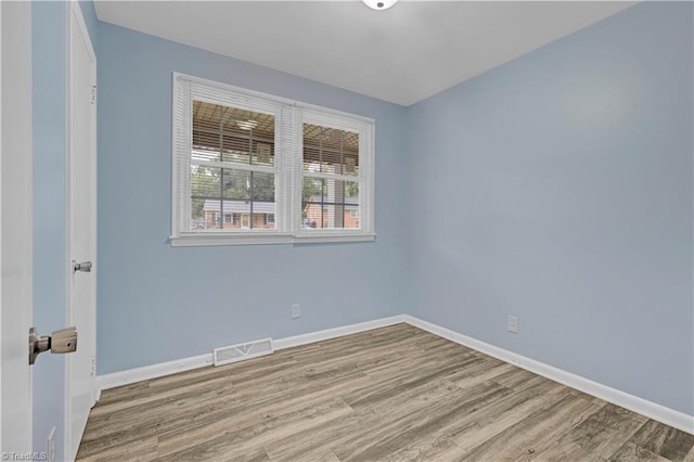 2102 Bothwell St, Greensboro, NC 27401 - empty room featuring wood finished floors and baseboards