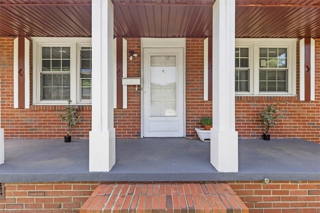 2102 Bothwell St, Greensboro, NC 27401 - property entrance featuring covered porch and brick siding