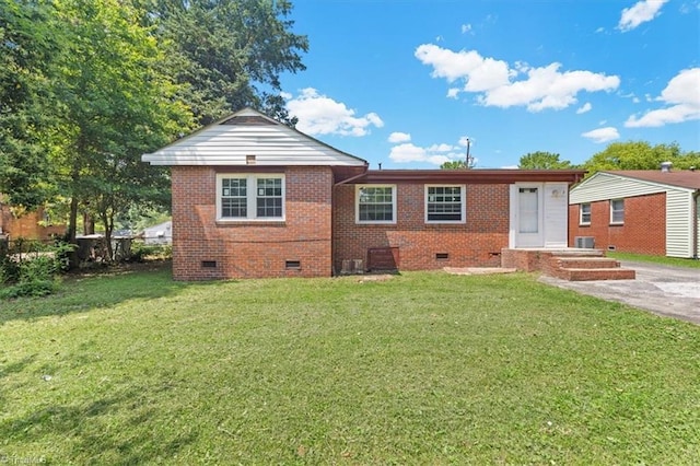 2102 Bothwell St, Greensboro, NC 27401 - view of front of property with crawl space, brick siding, and a front lawn